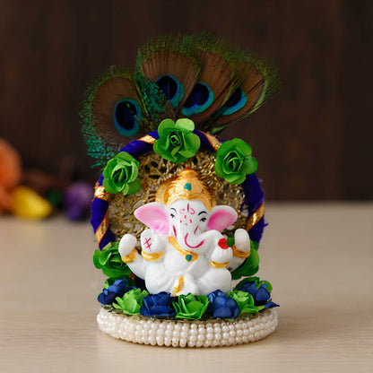 Lord Ganesha Idol on Decorative Handcrafted Floral Plate with Peacock Feather