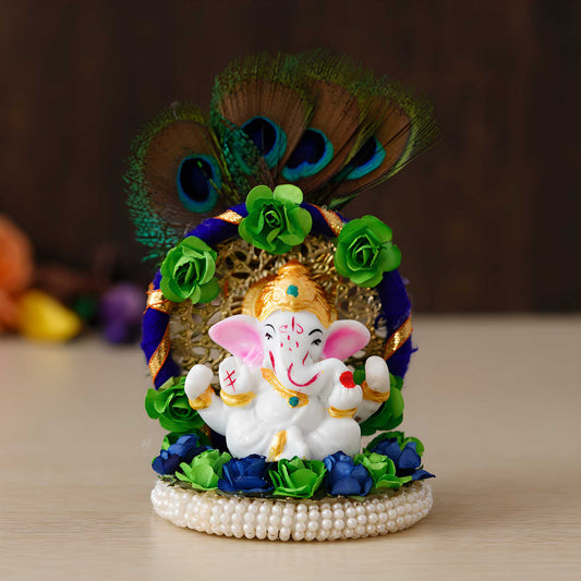 Lord Ganesha Idol on Decorative Handcrafted Floral Plate with Peacock Feather