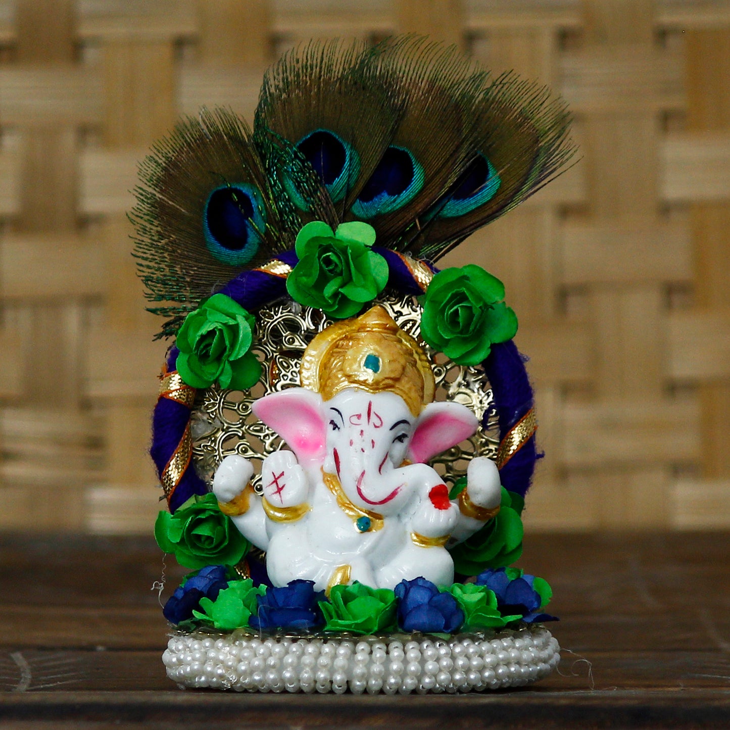 Lord Ganesha Idol on Decorative Handcrafted Floral Plate with Peacock Feather